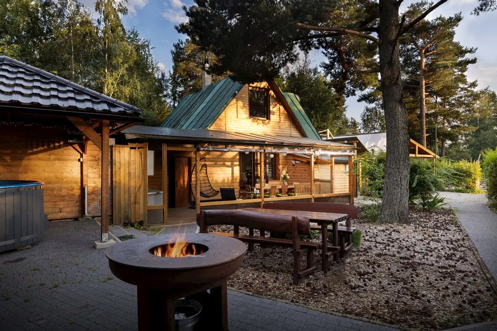 Outdoor hot tub and fire pit beside the chalet
